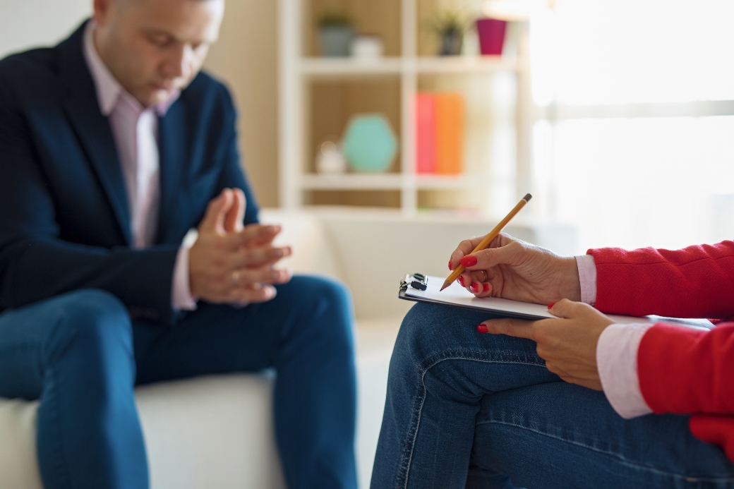 image representing man and psychologist in a depression treatment session