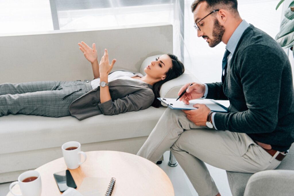 Psychiatrist giving advice to a female patient with anxiety problems