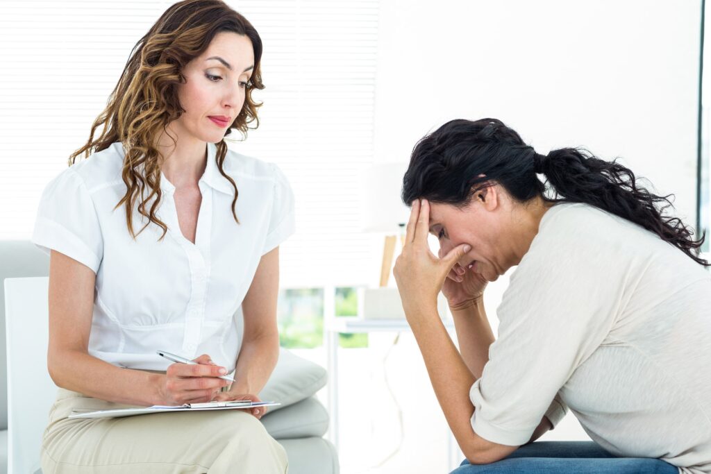 Therapist assuring a patient that Magellan Mental Health Rehab insurance can be use for treatment