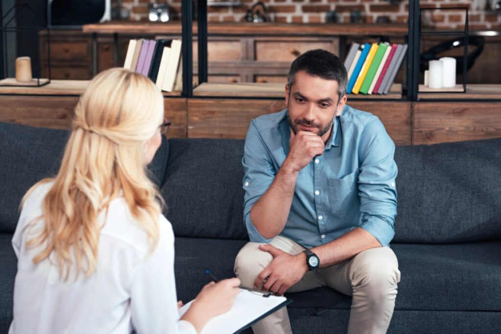 Man talking with her therapist about Multiplan mental health rehab