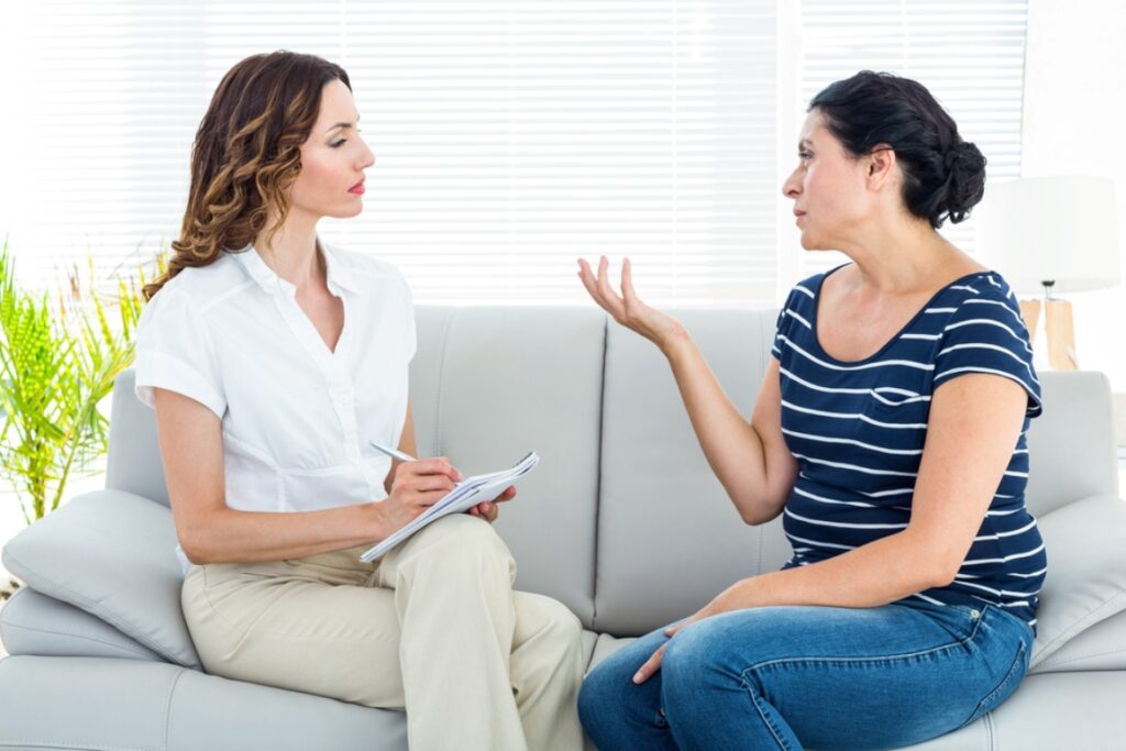 Depressed woman talking with her therapist